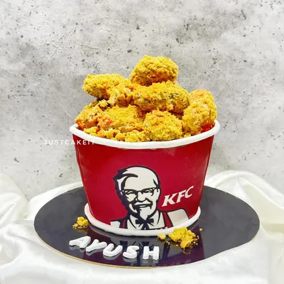 It's finger-lickin' good, and it's also a cake! This is my fully edible KFC bucket cake, made for a huge fan. The "chicken" is made from cake and a crunchy coating, and the bucket is also part of the cake.