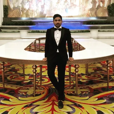 This is my classic black tuxedo, designed for ultimate sophistication. The focus is on a clean, sharp cut and a perfect fit that enhances your silhouette. It’s a demonstration of how traditional formal wear can be both powerful and personal.