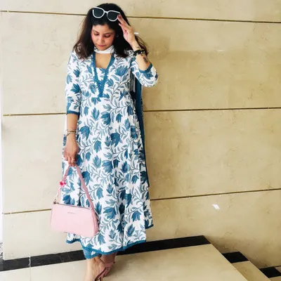 A full-length shot of my blue and white floral kurta set. I love to share my Indian fashion choices, showing how I blend modern styling with traditional ethnic wear.