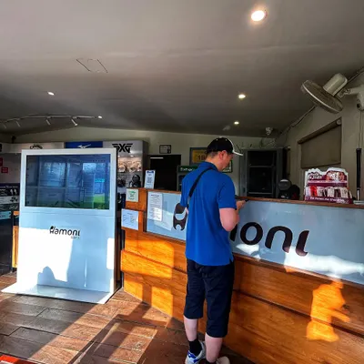 A player checks in at our ProShop reception, ready to get his session started.
