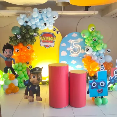 Here is another angle of the Paw Patrol birthday setup, showing the full arrangement with character props and personalized backdrops.