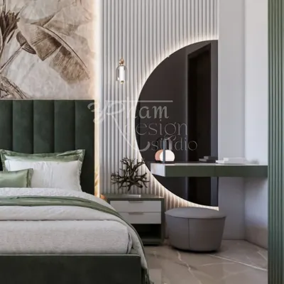 A complete view of the master bedroom's vanity area. The backlit circular mirror, sleek floating desk, and plush stool create a dedicated space for getting ready, seamlessly integrated into the room's serene design.