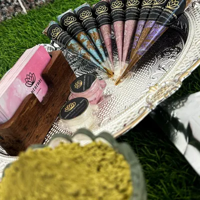 My luxury henna products are available for purchase. This includes my signature organic henna powder, aftercare balms, and freshly rolled cones, all beautifully presented.
