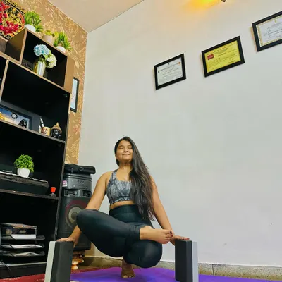 Here I am demonstrating how to use yoga blocks for support in a squatting balance pose. Props are fantastic tools for beginners to build confidence and maintain alignment.