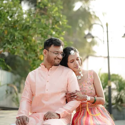 A close-up of a couple sharing a quiet, happy moment during their engagement photoshoot.