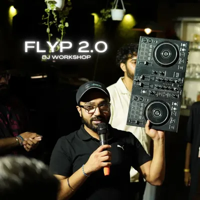 Here I am during a session, explaining the functions of a Pioneer DJ controller. We make sure you get comfortable with industry-standard equipment from day one.
