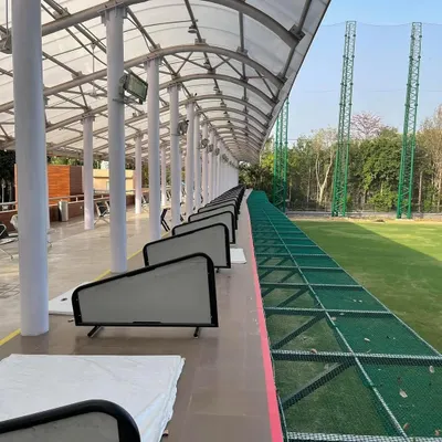 A view down the line of our upper-tier driving bays. Each bay provides a clean, spacious area for you to focus on your practice session.