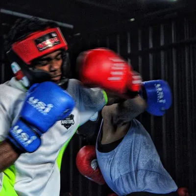 A clean shot from a Friday morning sparring session. Here you see a fighter landing a jab while maintaining his guard, a fundamental of good boxing defense.