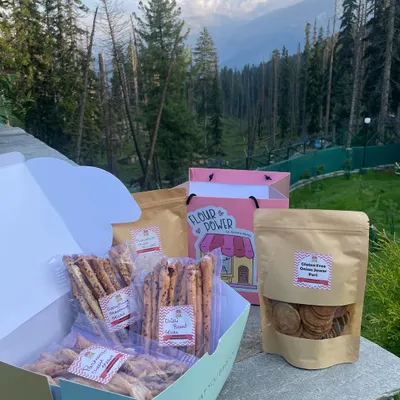 My travel-friendly snack box, featuring an assortment of gluten-free goodies. This box includes everything-seasoning breadsticks, parmesan cheese straws, and jaggery makhana.