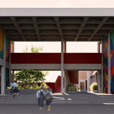 The main entrance of the school in Mandya is designed as a welcoming, double-height portal. The exposed coffered slab and colorful murals add visual interest, creating an inspiring gateway for students and the community.