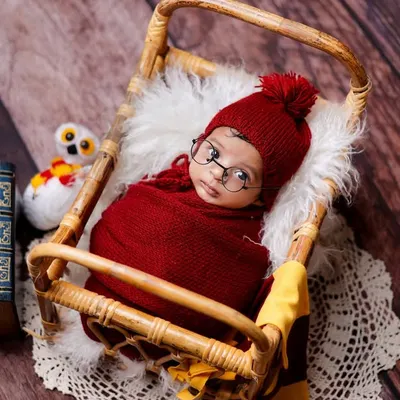 Our Harry Potter theme is a client favorite. We have all the details covered, including the iconic glasses, a Gryffindor-red wrap, a cozy bed, and a stack of magic books.