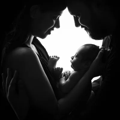 The hero of monochrome. This silhouette of parents and their newborn is a powerful, artistic statement about love and new beginnings, made even more dramatic in black and white.