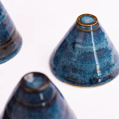 This is "Midnight Blue," one of our most popular Trana glazes. It’s a deep, rich blue that often breaks into beautiful reds, browns, and blacks after firing, making every piece unique.