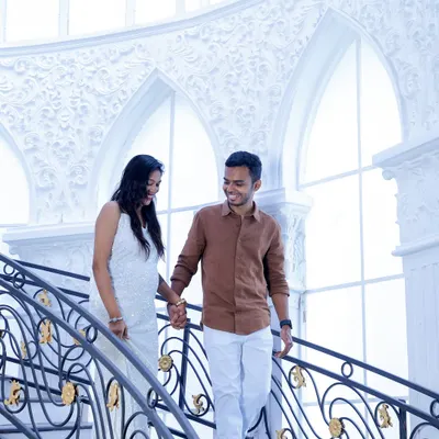 We found the perfect grand indoor location for this couple's pre-wedding shoot. The ornate ironwork and bright, airy architecture provided a fairytale setting for their romantic and candid portraits.