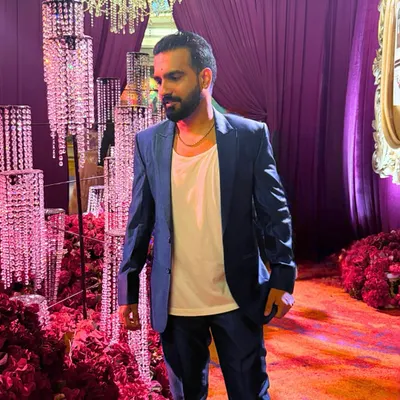 Slaying the blues, not suffering from them. A sharp blue suit for a Thursday night event.