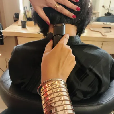 A client wanted a shaggy bob with a 'secret kink'. This is the start of a personalized undercut, a solid foundation for a hidden piece of art.