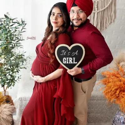A beautiful couple announcing their baby girl in our boho studio. I love using props like this little chalkboard heart to make your pregnancy announcement extra special.