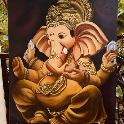 I painted Ganesha in warm gold tones against a dark background, with his crown and ornaments filling the canvas.