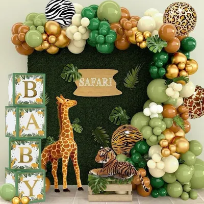 Welcome to the jungle. This safari-themed baby shower features a lush green backdrop, animal print balloons, and friendly giraffe and tiger props. The "BABY" blocks add a classic touch to this wild and fun celebration.