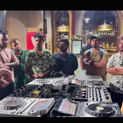 My teaching philosophy is simple: get hands-on with real, professional equipment. Here I am walking a group of aspiring DJs through the features of a full Pioneer DJ setup during a masterclass in Hyderabad.