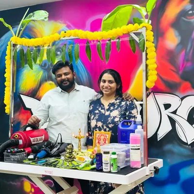 My wife and I during our salon's Ayudha Pooja. We are a family-run business, and we put our hearts into creating a blessed and positive environment for all the pets who visit us.
