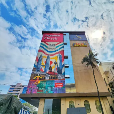 A stunning wide-angle shot of our 100-foot mural for Malaysia Tourism, covering the side of the Jagadish Hotel in Bengaluru.