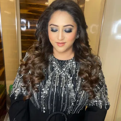 The perfect cocktail glam. This look features a beautifully blended silver and grey smokey eye, paired with soft, voluminous curls for an evening of elegance.