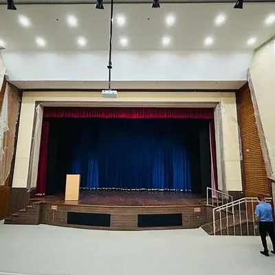 Here you can see the project nearing completion, with scaffolding still in place as we finalize the installation of the main projector and overhead lighting rigs. This stage involves meticulous testing of all AV components.