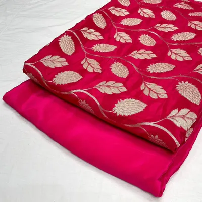 This vibrant rani pink jacquard fabric features a beautiful woven leaf pattern. I've paired it with a matching plain crepe silk, perfect for creating a coordinated kurta and bottom set.