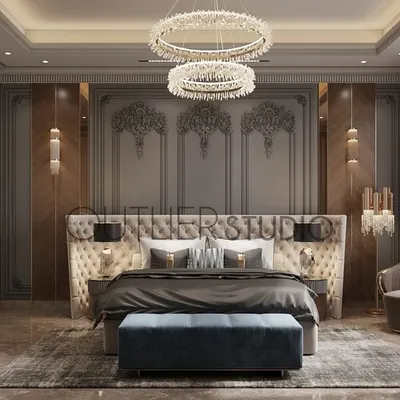 Creating a space where elegance meets comfort. This master bedroom features a tufted headboard set against a backdrop of classic wall mouldings and chevron-patterned veneer panels, with a pop of deep blue for sophistication.