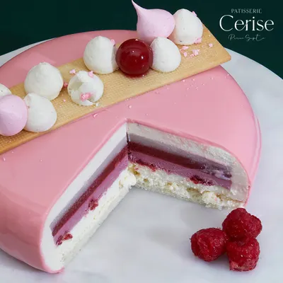 My Explosion of Berries entremet is a delightful symphony of flavours and textures. This cross section shows the vibrant sweetness of strawberries and raspberries, the exotic touch of lychee, and the smooth richness of vanilla.