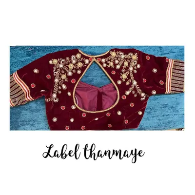 A rich maroon velvet blouse with heavy zardozi and bead embroidery. This kind of blouse is perfect for a bridal trousseau.