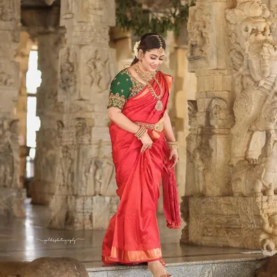 A candid moment of joy captured within the historic corridors of a temple. The bride's laughter echoes against the ancient stone, creating a beautiful contrast.