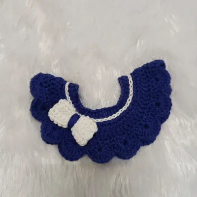 I love making these sweet detachable collars for little ones. This one is a lovely royal blue with a white bow, all handmade from soft, 100% cotton yarn that's gentle on baby's skin.
