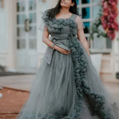 Make a statement at your next event with this elegant grey frill gown. The detailed ruffles and flattering silhouette make it a showstopper for pre-wedding events, birthday parties, or cocktail nights.