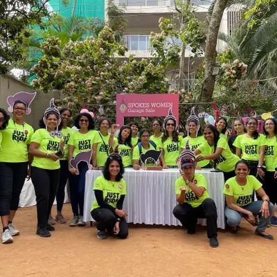The volunteer crew at our annual Garage Sale, all in our bright 'Just Ride' tees. This photo captures the energy and teamwork that makes our community events so successful.