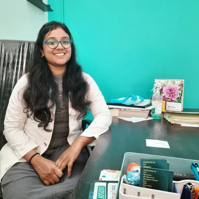 A photo of me at my desk in the clinic. I am always ready to listen to your concerns and create a personalized treatment plan that works for you.