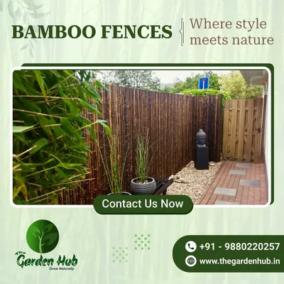 This dark bamboo fence creates a stunning, resort-like feel in a small courtyard. The natural material provides complete privacy and serves as a beautiful backdrop for the plants and stone accents.