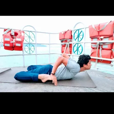 Bhekasana, the Frog Pose, provides a deep stretch for the quadriceps and hip flexors while opening the chest. This back-bending asana is excellent for improving posture and stimulating the abdominal organs.