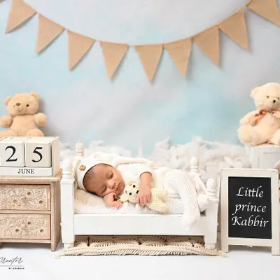 Little prince Kabbir is dreaming sweetly in his own little bedroom setup. Surrounded by teddy bears and a personalized nameplate, this classic theme is always a favorite.