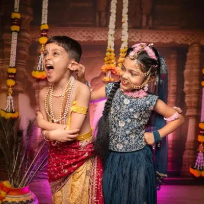 The playful mischief of Radha and Krishna, beautifully enacted by these two siblings. Our themed shoots are a wonderful way for children to have fun while creating culturally rich and memorable photographs.