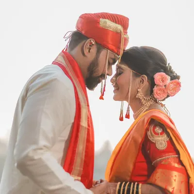 The moment just before a kiss, full of anticipation and love. This intimate close-up of a Maharashtrian couple captures the pure emotion of their wedding day.