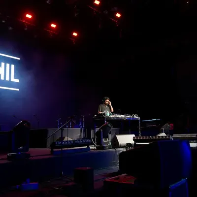 A side view of me on the main stage at NSCI Dome. The scale of the production was massive, and it was an honor to set the vibe.