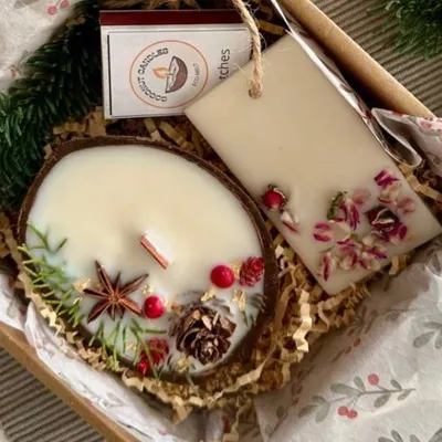 My eco-luxury gift set, featuring a coconut shell candle and a wax sachet, both adorned with dried botanicals. It's a perfect sustainable gift for Diwali or corporate hampers.