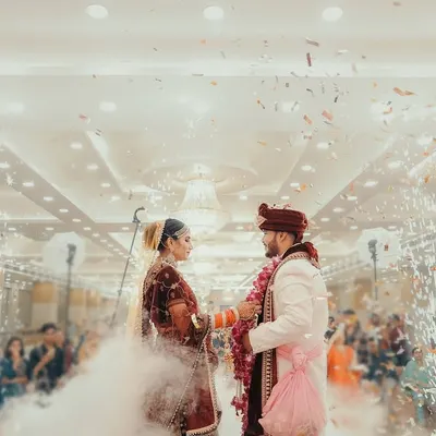 The Varmala is such a peak moment of the wedding. I love to make it feel as epic as it is, using effects like this cloud of smoke and confetti to create a truly cinematic and unforgettable memory of the couple's exchange.