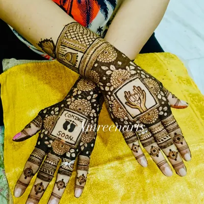 Henna hands waiting for tiny baby feet. This baby shower design features a "Coming Soon" message with little footprints and a beautiful drawing of a mother holding her hands in prayer.