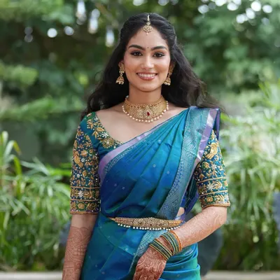 A joyful portrait of the bride-to-be. Her makeup is kept fresh and luminous to complement the daytime event, with soft contouring and a natural lip color.