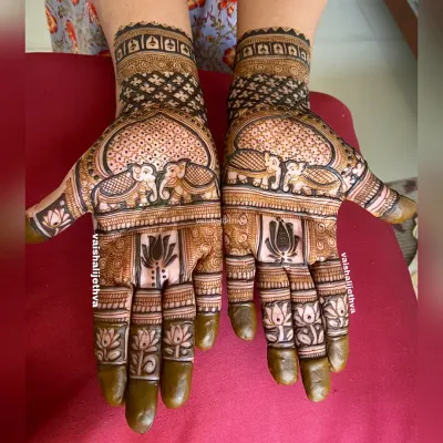 A beautiful combination of elephant motifs and lotus flowers. This design is a great example of how traditional elements can be used in a modern, less dense pattern.