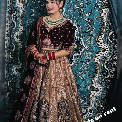 This is one of my most requested bridal looks. A rich maroon velvet blouse and detailed lehenga paired with a stunning green beaded Kundan necklace set. This rental is perfect for a classic winter wedding.