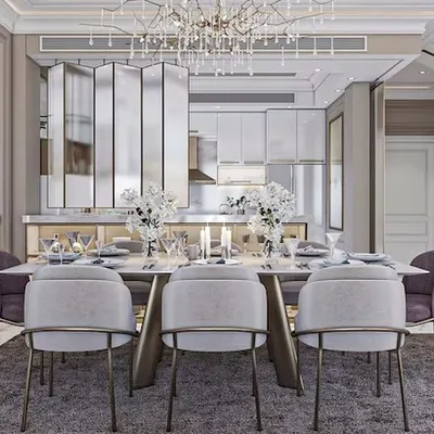 A luxurious open-plan dining area featuring a marble-top table, plush velvet chairs, and a mirrored partition that adds depth and glamour to the space.